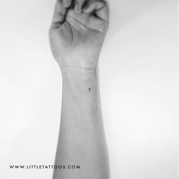 simple cross wrist tattoo