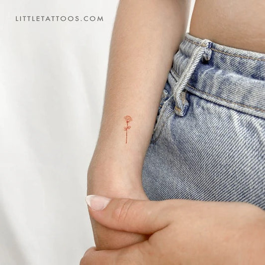 Red tattoos: Little red rose tattoo