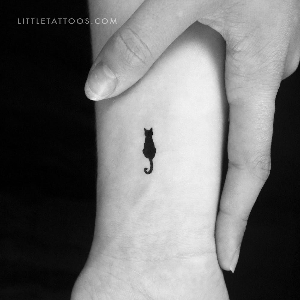 Small cat outline tattoo